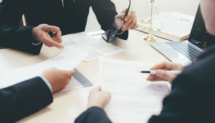 a group of lawyers in discussion